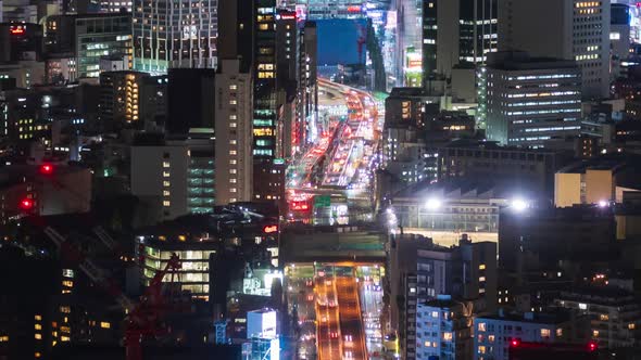 time lapse of the Metropolitan Expressway no.3 Shibuya Line and city at night in Tokyo, Japan