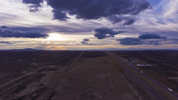 Cars on Highway at Sunset