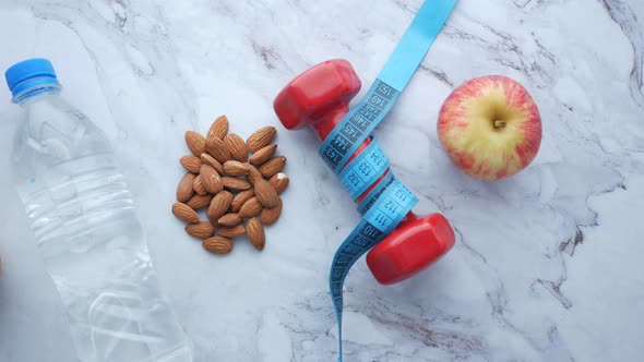 Diet Plan with Almond Nut Dumbbells Banana on Table