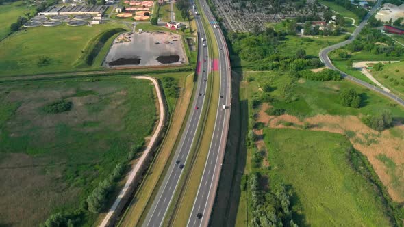 Aerial View Of A Freeway. Descending Shot Cars Driving By the Road. Traffic on the Highway. Footage