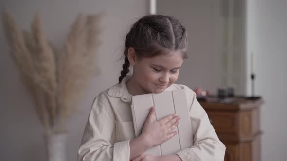 Girl Child Blogger with a Mobile Gadget Broadcasts in Zoom