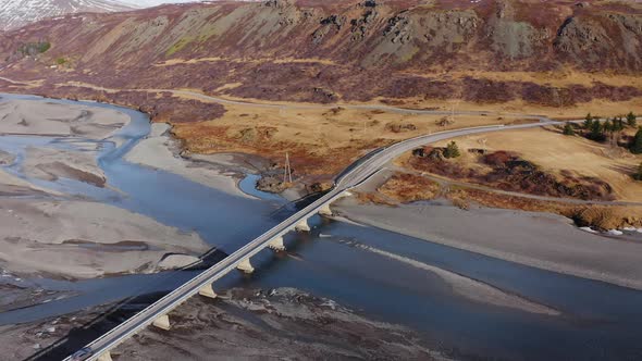 Drone Over Car Crossing Bridge Over Hvannagil Estuary