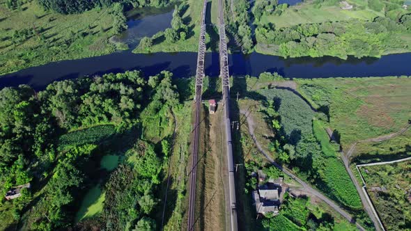 Railroad Bridge and River at Beautiful Sunlight in Summer