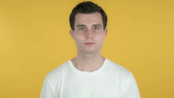Man Inviting Customers with Both Hands, Yellow Background