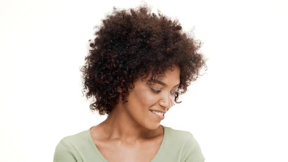 Shy Young Beautiful African Girl Smiling Over White Background