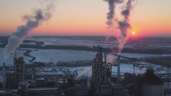 Aerial View of Cement Factory Tower with High Concrete Plant Structure at Industrial Production Area