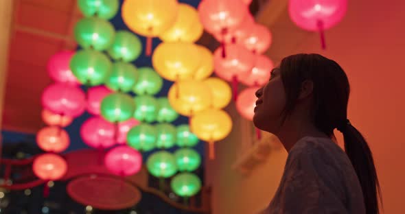 Woman look at the chinese lantern at night