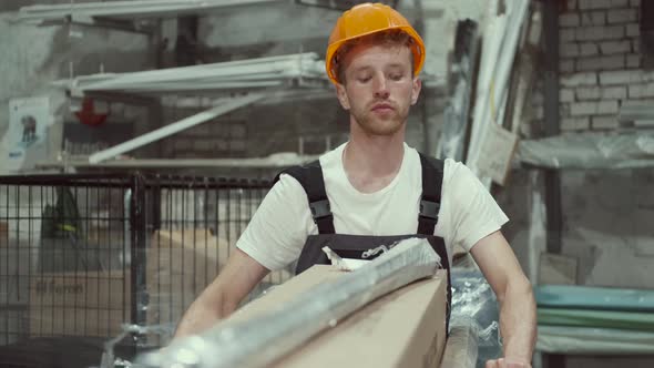 Worker Is Carrying the Materials at the Store