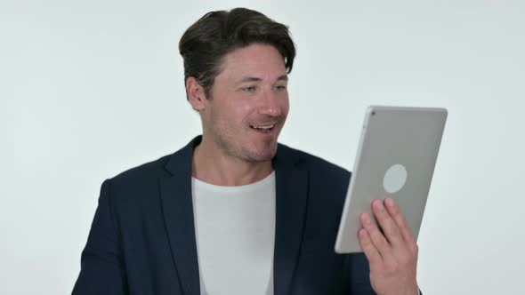 Video Chat on Tablet By Middle Aged Businessman, White Background