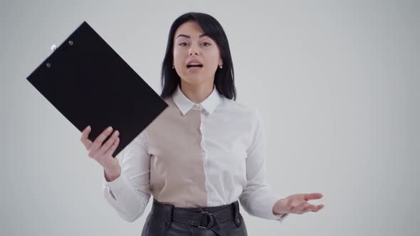 Studio portrait of angry businesswoman. Portrait of businesswoman on grey background