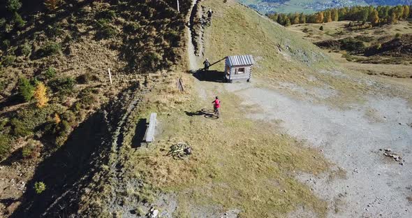 Aerial drone view of a group of mountain bikers on a singletrack trail.