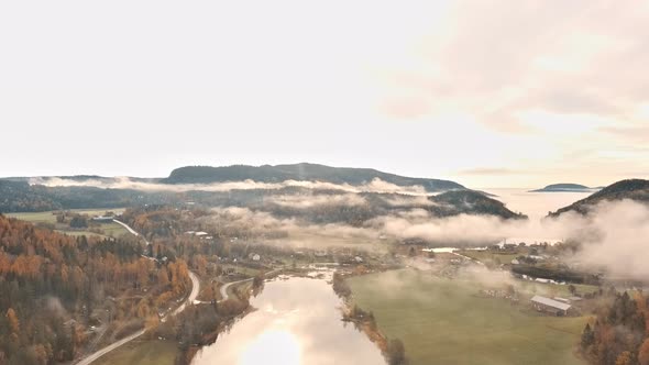 Misty mountains with river below