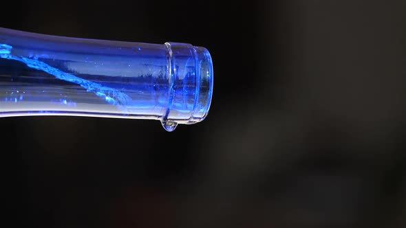 Water Pouring From a glass Bottle