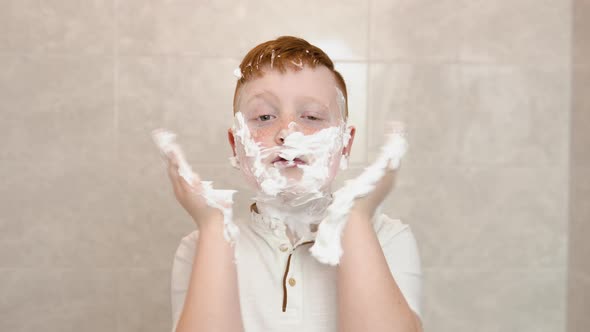 Funny Boy in the Bath Smears His Face with Shaving Cream the Child Imitates an Adult Dad Shaves