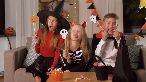 Kids in Halloween Costumes Having Fun at Home