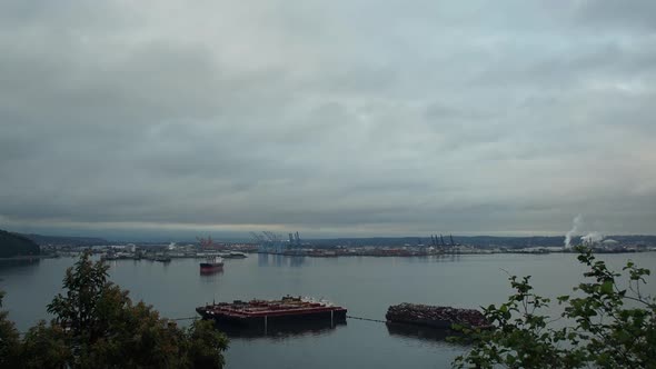 Time Lapse of a cloudy sunrise over the Port of Tacoma, Washington. Seen from Browns Point, rolling