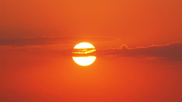 Sunset Through the Clouds in the Red Sky.