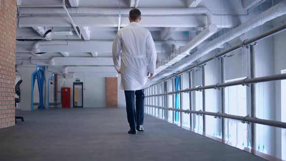 Unrecognizable Doctor Walks Indoors