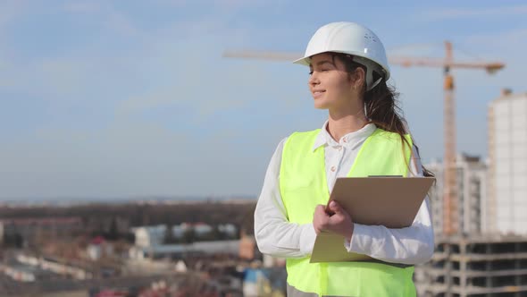 Portrait of a Happy Female Engineer Who is Looking at the Camera