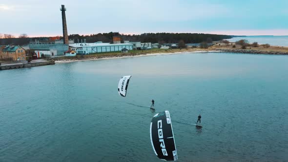 Aerial Drone View of a Corekites Kitesurfers Hydrofoiling  in Engure Port at in Baltic Sea