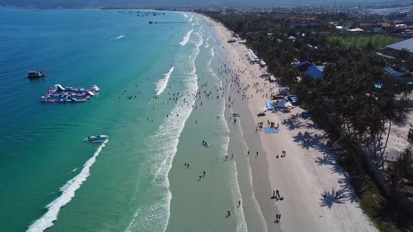 Tourists Relax on Beach, Walk Along Recreation Complex.