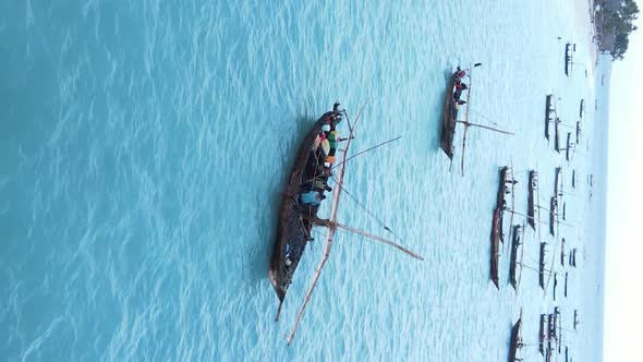 Vertical Video Boats in the Ocean Near the Coast of Zanzibar Tanzania Aerial View