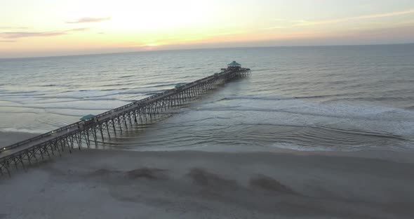 Aerial of Folly Beach Fishing Pier at Sunrise with Birds