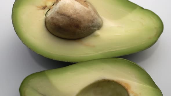 Avocado Slices Closeup, Macro Food Summer Background, Fruits Top View. Rotate