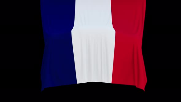 The piece of cloth falls with the flag of the State of France to cover the product