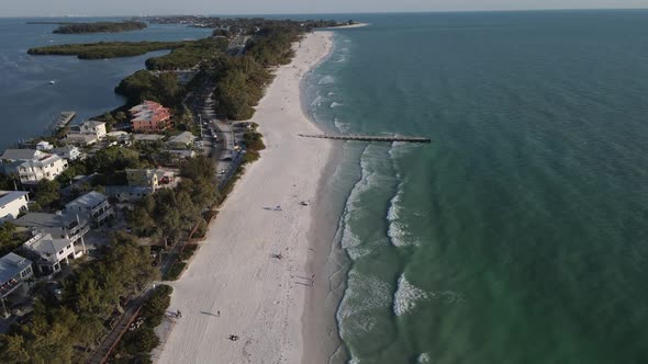 white sugar sands of Cortez Beach in Bradenton, Florida, aerial going south toward Sarasota, Florida