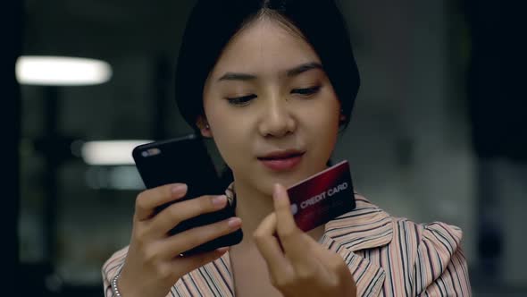 Teenage Girl Using a Mobile Phone to Buy Online Products 10