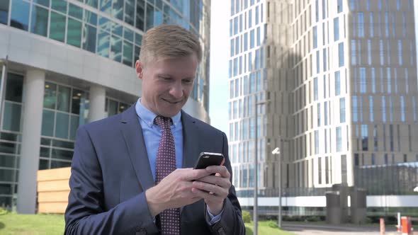 Businessman Using Smartphone