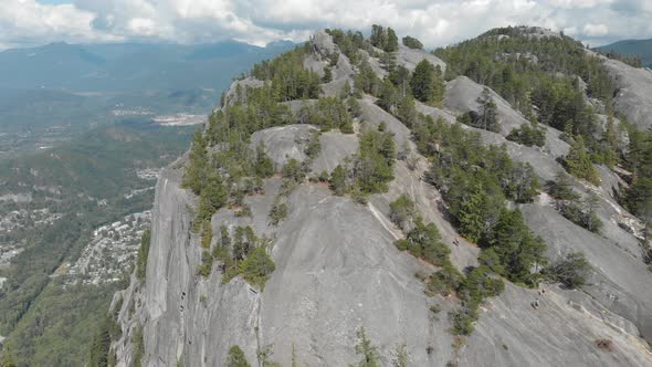 Aerial view of Chief Mountain during a cloudy day. Taken in Squamish, North of Vancouver, British Co