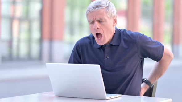 Outdoor Middle Aged Businessman Having Back Pain on Laptop