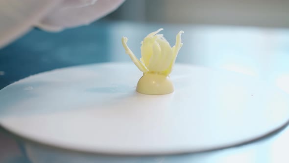 Confectioner Attaches Small Petal to White Chocolate Flower