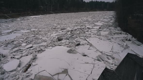 Huge Ice Loads Drift in the River Ogre, Latvia. Stedicam Shot 4K