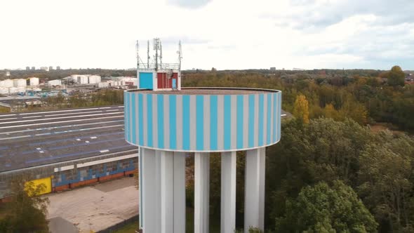 Drone pulls back from a water tower in Antwerp Belgium.
