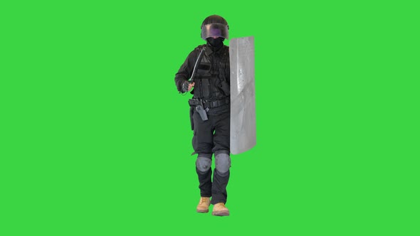 Soldier in Full Uniform with Armor Baton Protective Shield Running on a Green Screen Chroma Key