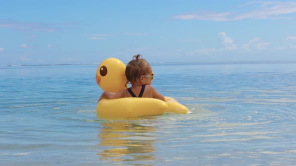 Adorable Little Girl on Warm and Sunny Summer Day on the Coastline Indian Ocean