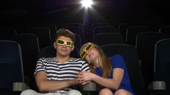 Great Movie! Young Couple Feeding Each Other at the Cinema. 3D Glasses