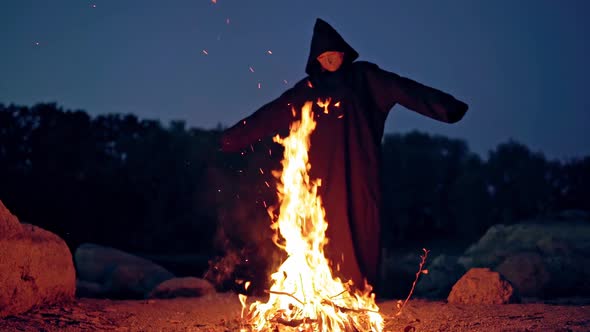 Mysterious witch near fire