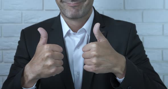 Cheerful Thumbs Gesture in Business