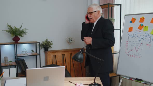 Angry Senior Business Man Making Phone Call at Office Work Annoyed Boss Talking Mobile Quarrel