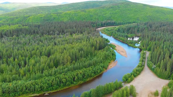 4K Drone Video (truck right shot) of Beautiful Bend in the Chena River as it runs through Pine Tree