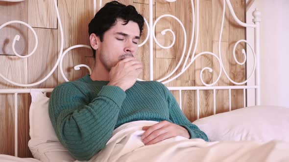 Coughing Sick Man in Bed at Night Throat Infection