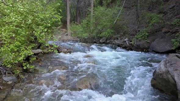 Flying low over the American Fork River up stream