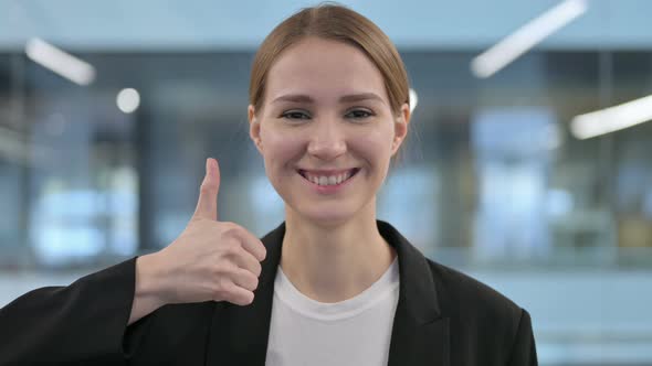 Portrait of Businesswoman Showing Thumbs Up Sign