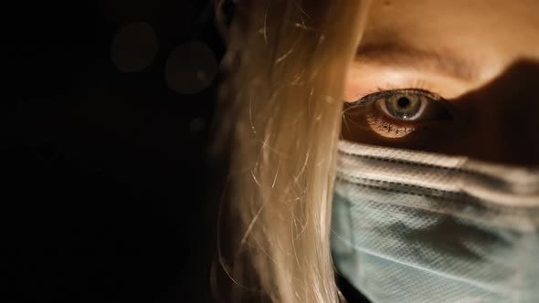 Close View Scary Eye of Female Medical Doctor in Face Mask