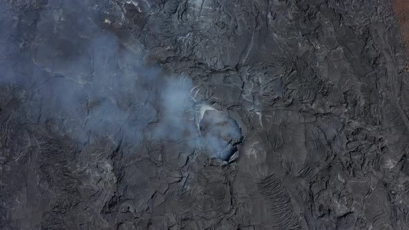 Aerial Birds Eye Overhead Top Down View of Fagradalsfjall Volcano Smoking Crater Fissure Hole Drone