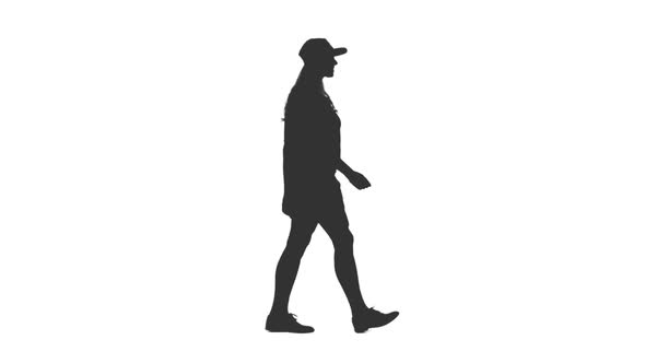 Silhouette of Girl with Long Hair Walks in Shorts and Cap